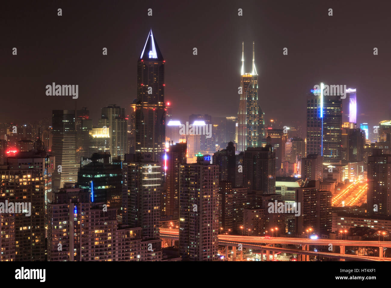 Shanghai, China - March 2, 2017: Shanghai skyline at night with the Shimao International Plaza and Tomorrow Square Towers on background Stock Photo