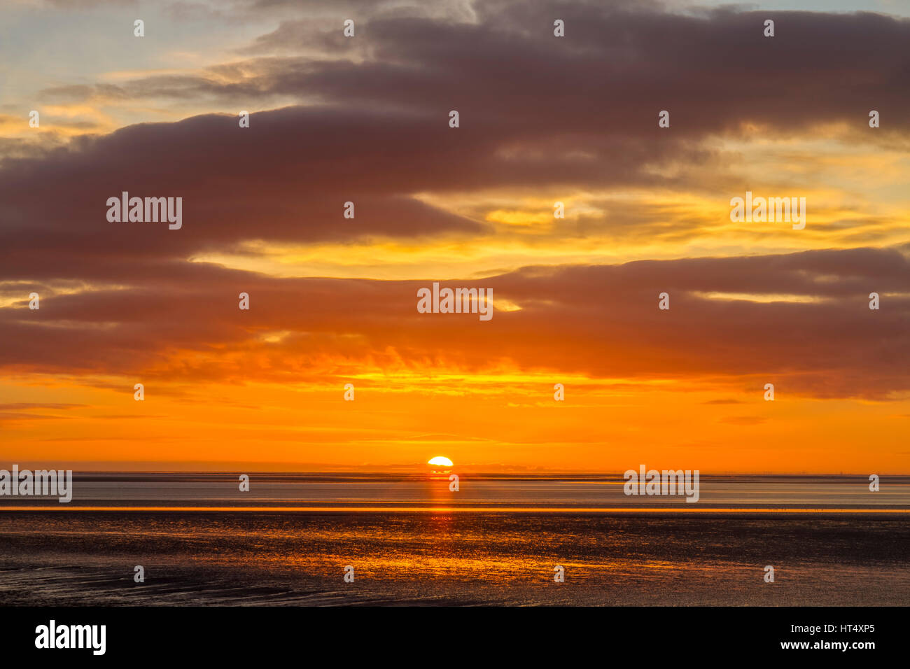 View over bay at sunset. Silverdale, Morecambe Bay, Lancashire, England. November. Stock Photo