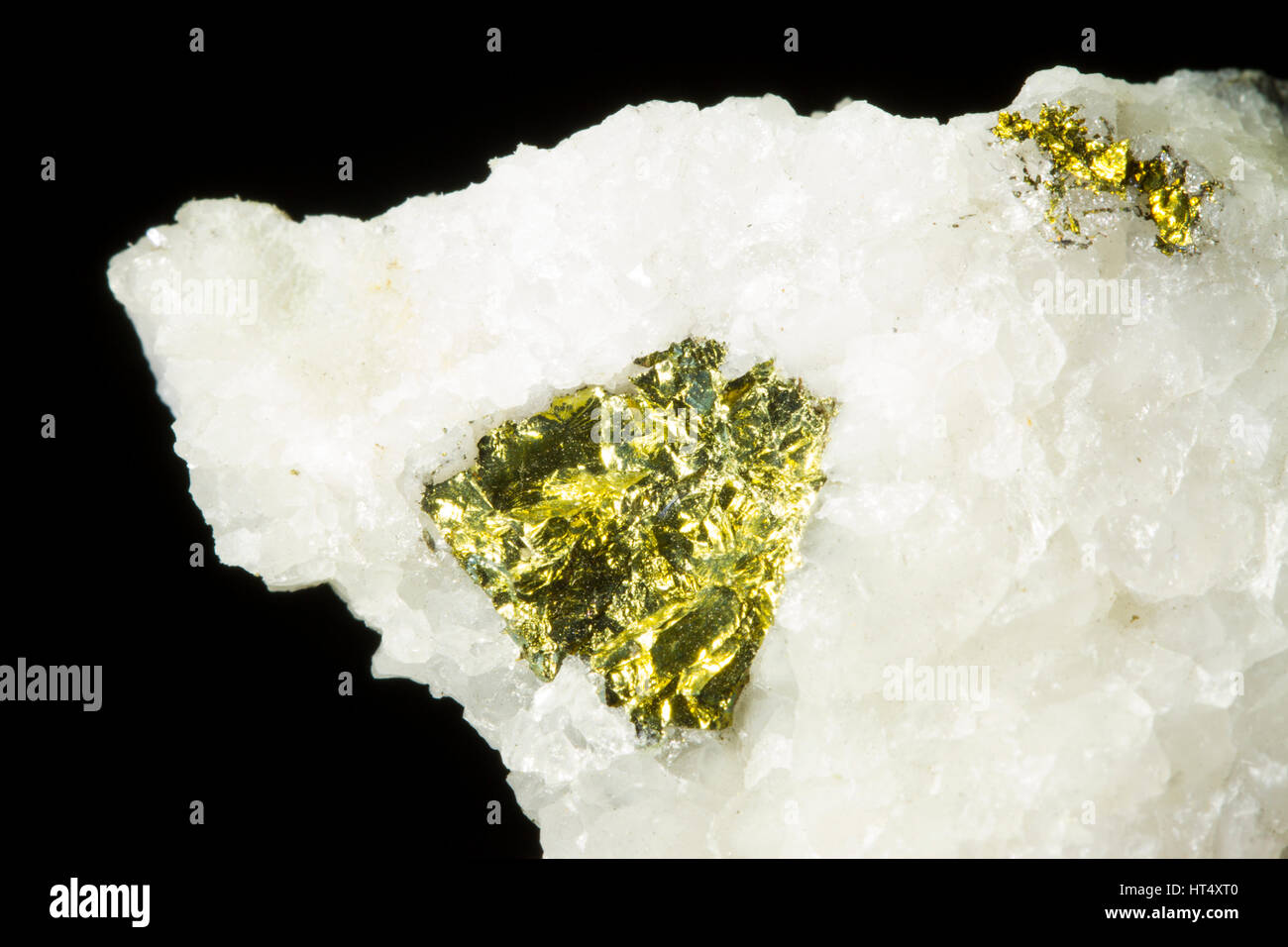 Chalcopyrite (copper iron sulphide) in quartz. From the  Hyddgen mine, Powys, Wales. Stock Photo