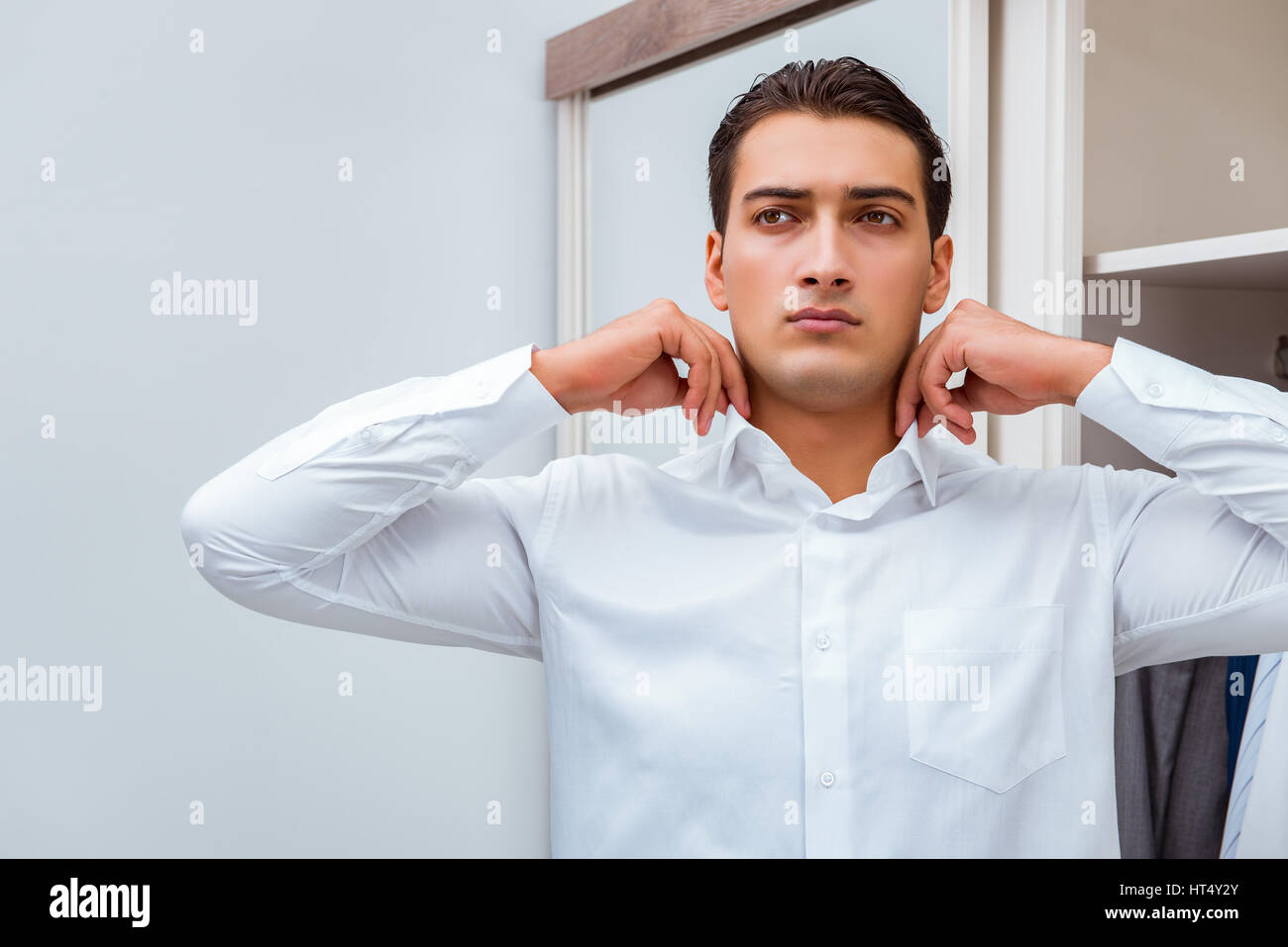 Businessman dressing up for work Stock Photo Alamy