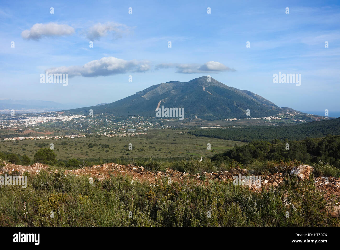 Maquis scrubland with Sierra de Mijas, and white village Alhaurin el grande, Andalusia, Spain. Stock Photo