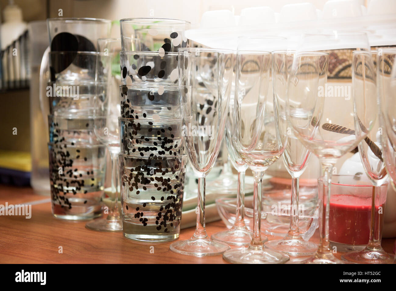 Clean glassful and wine glasses on the table Stock Photo