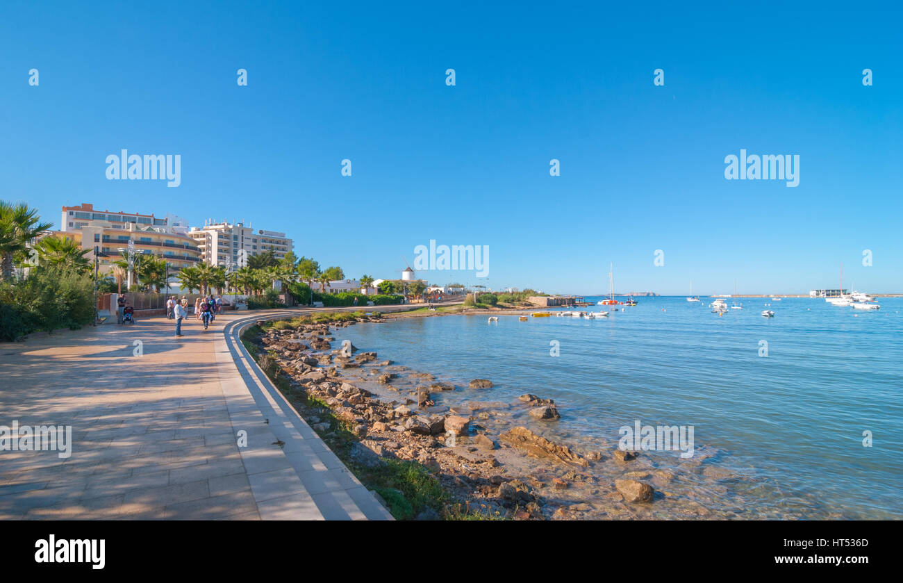 Ibiza sunshine on the waterfront in Sant Antoni de Portmany,  Take a walk along the main boardwalk, now a stone concourse beside the beach. Stock Photo