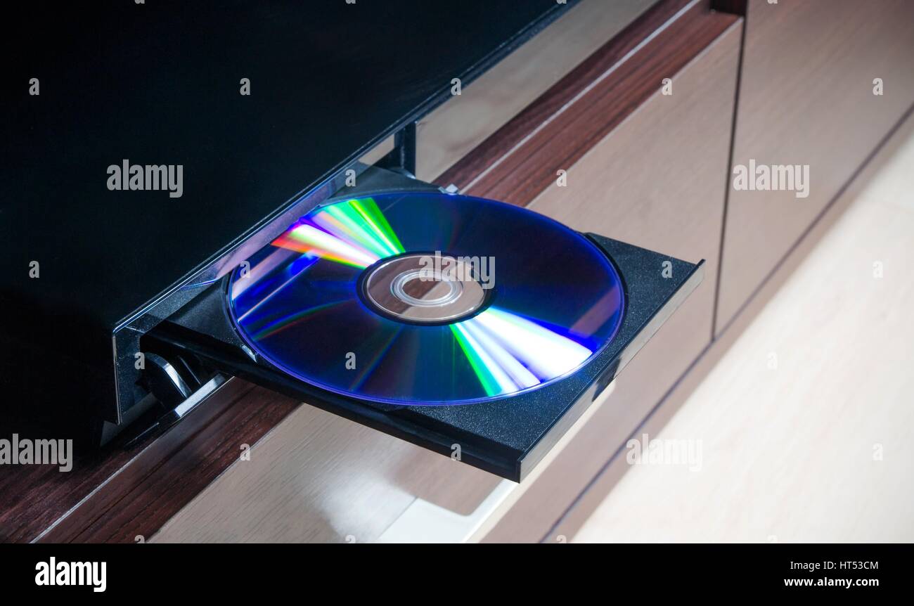 Disc insterted to DVD or CD player Stock Photo