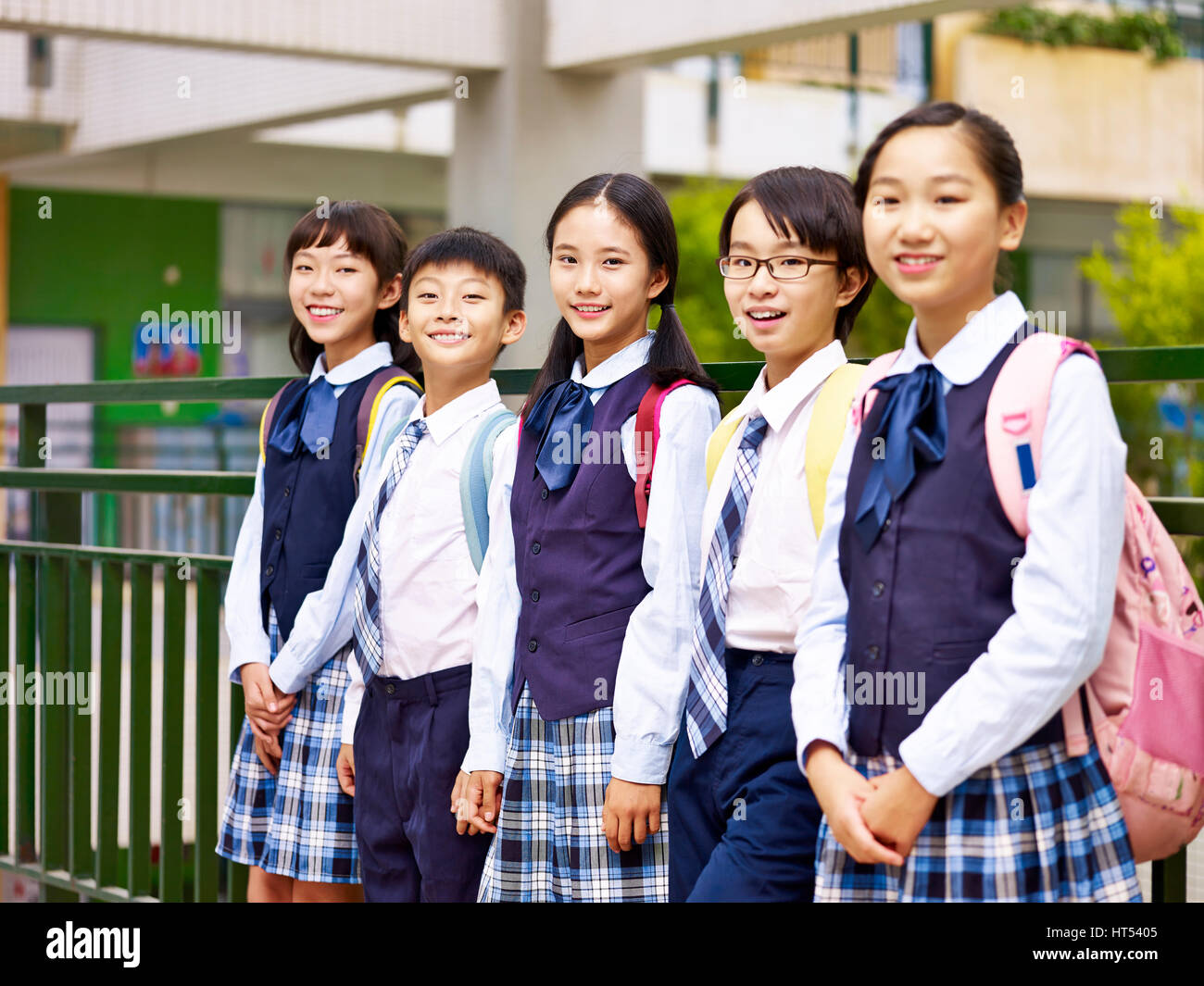 portrait of a group of asian elementary school children looking at camera smiling Stock Photo