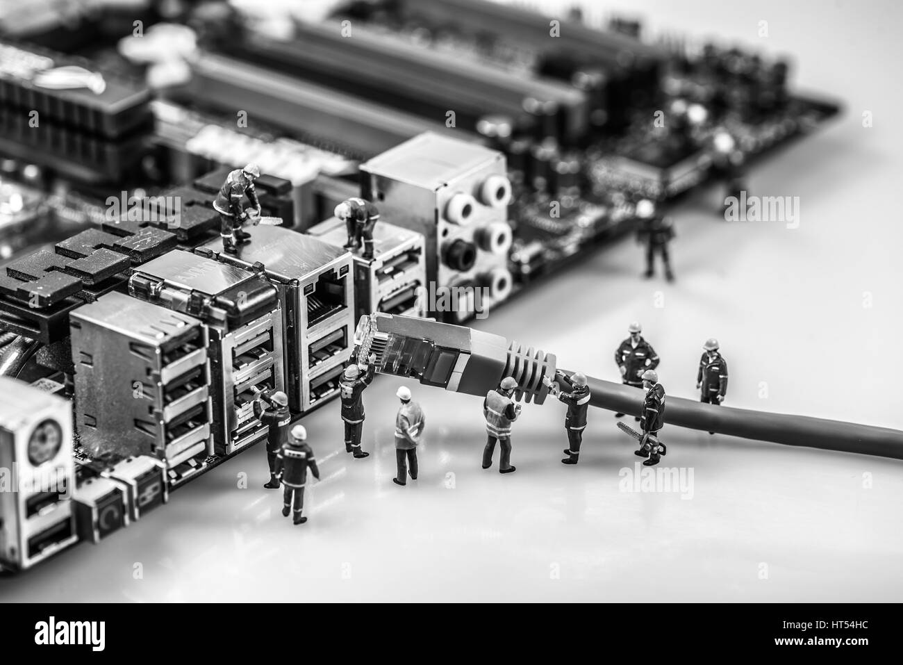 Technicians connecting network cat5 cable to motherboard. Macro photo Stock Photo