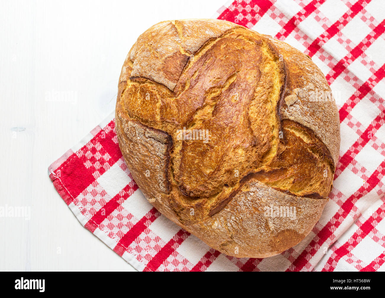Selective focus baked bread isolated on red and white canvas Stock Photo
