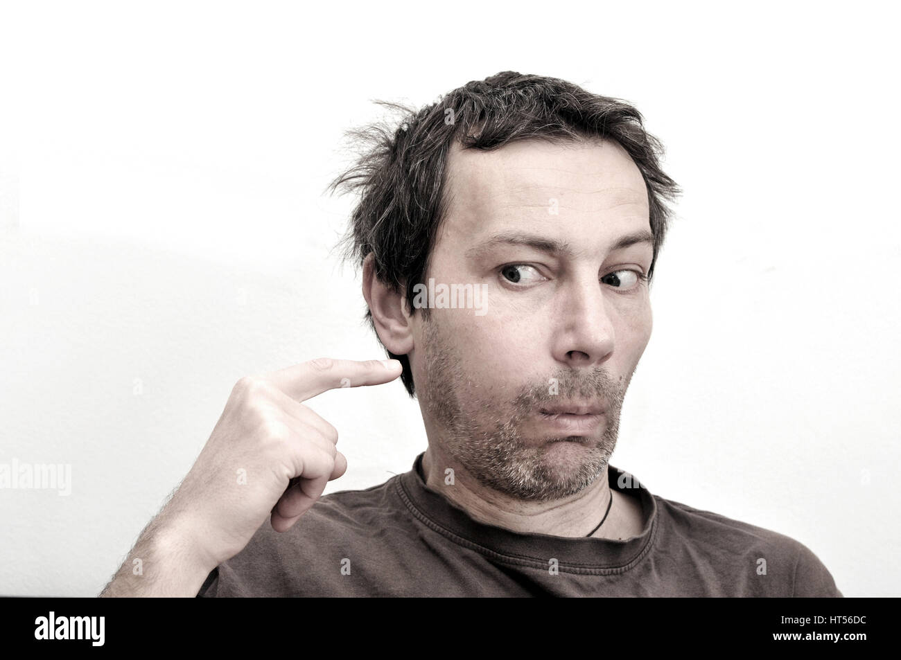 Young man suffering from toothache, teeth pain, swollen face Stock