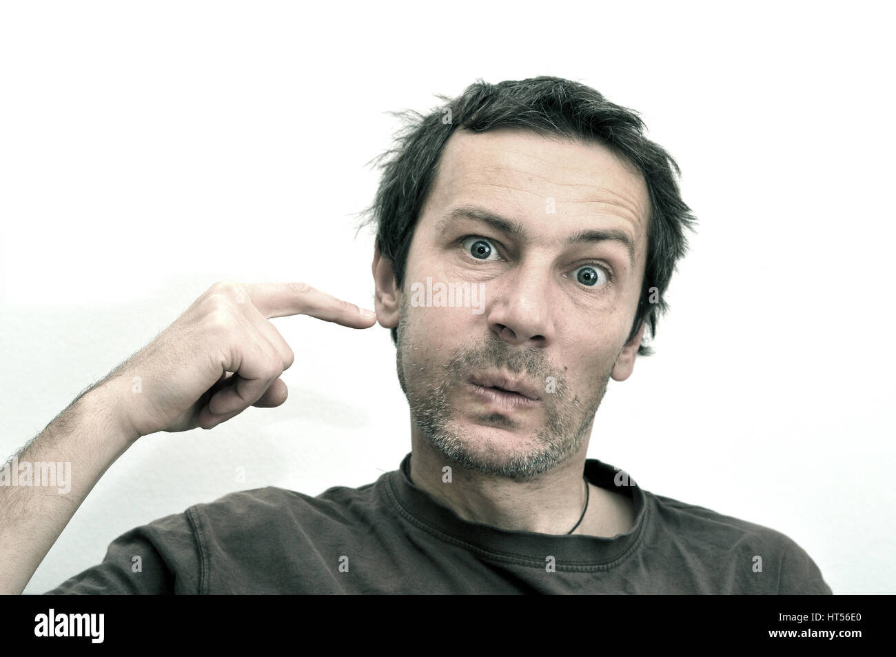 Young man suffering from toothache, teeth pain, swollen face Stock