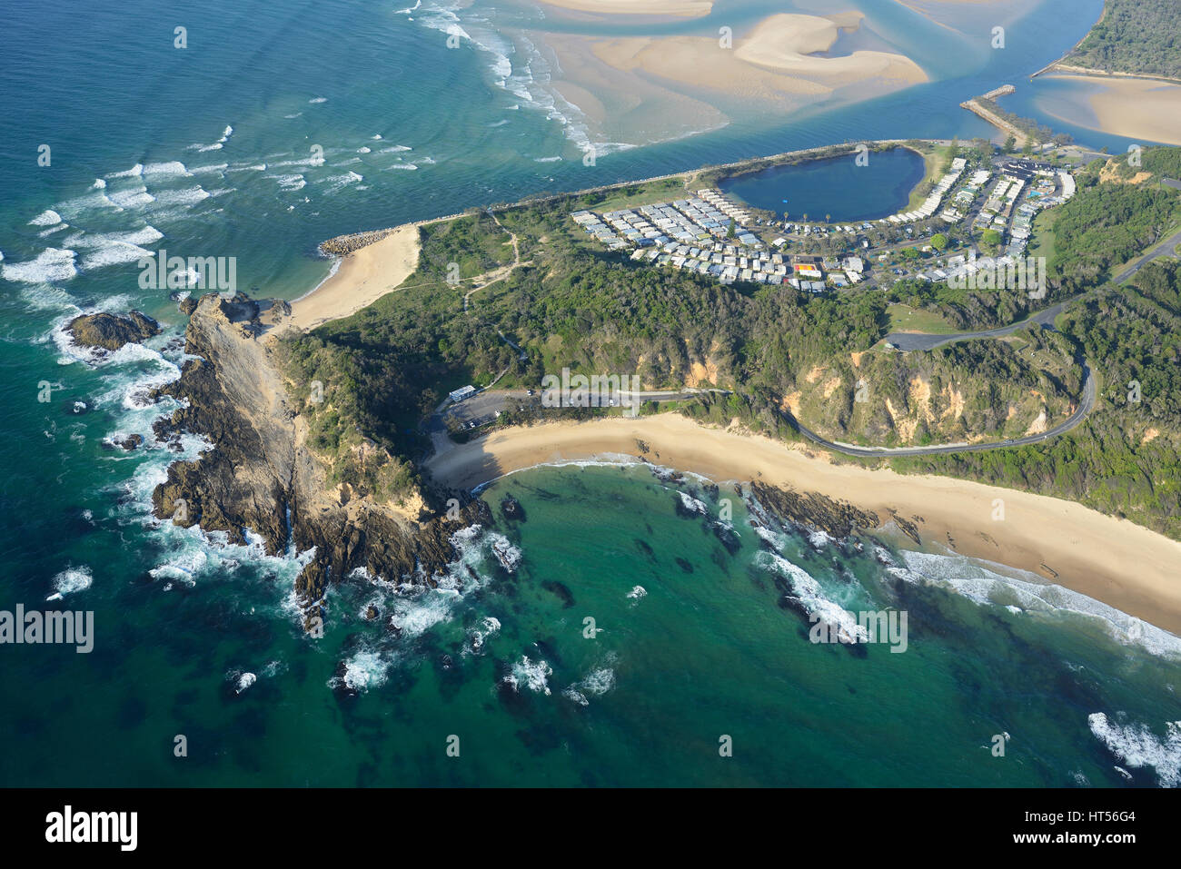 AERIAL VIEW. Rocky promontory of Nambucca Heads between Shelly Beach and the Nambucca River mouth. New South Wales, Australia. Stock Photo