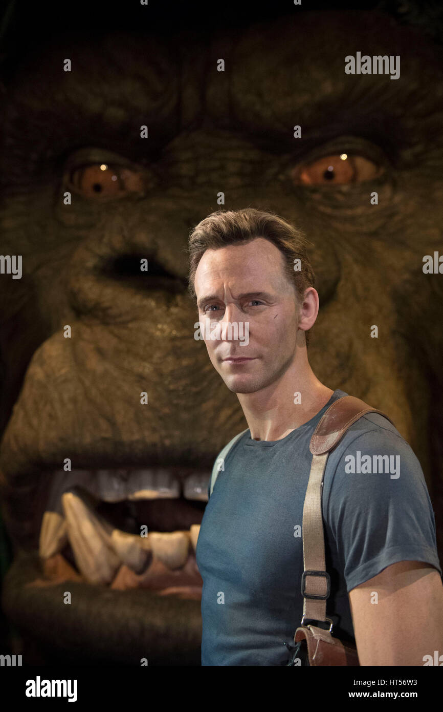 A waxwork of Tom Hiddleston in front of a multi-sensory, animatronic head of Kong, as they are unveiled at Madame Tussauds, London. Stock Photo