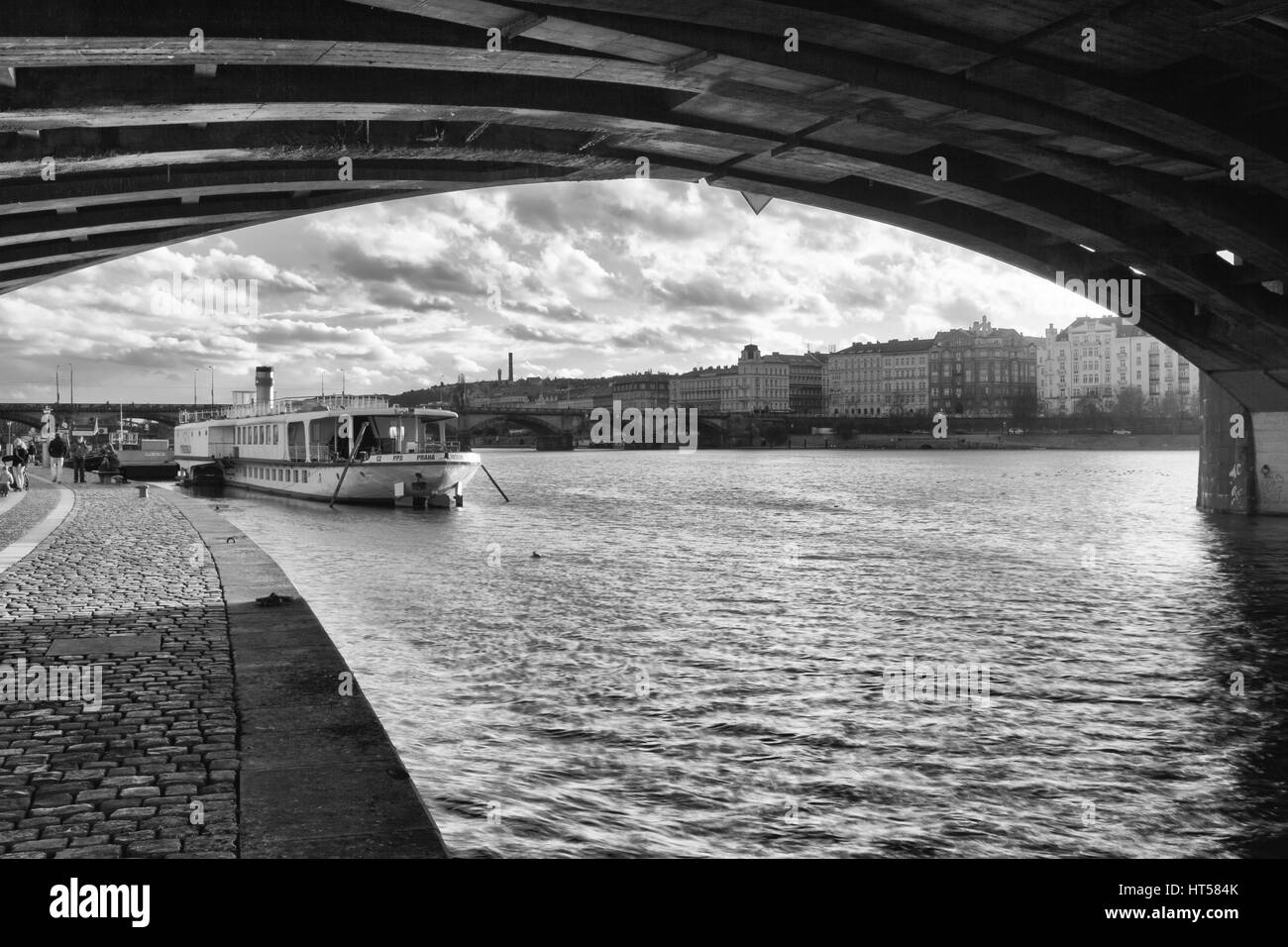 Prague,Czech Republic - March 3,2017: View on the Vysehrad boat under the bridge after rain.Vyšehrad is one of the last two remaining operating steamb Stock Photo