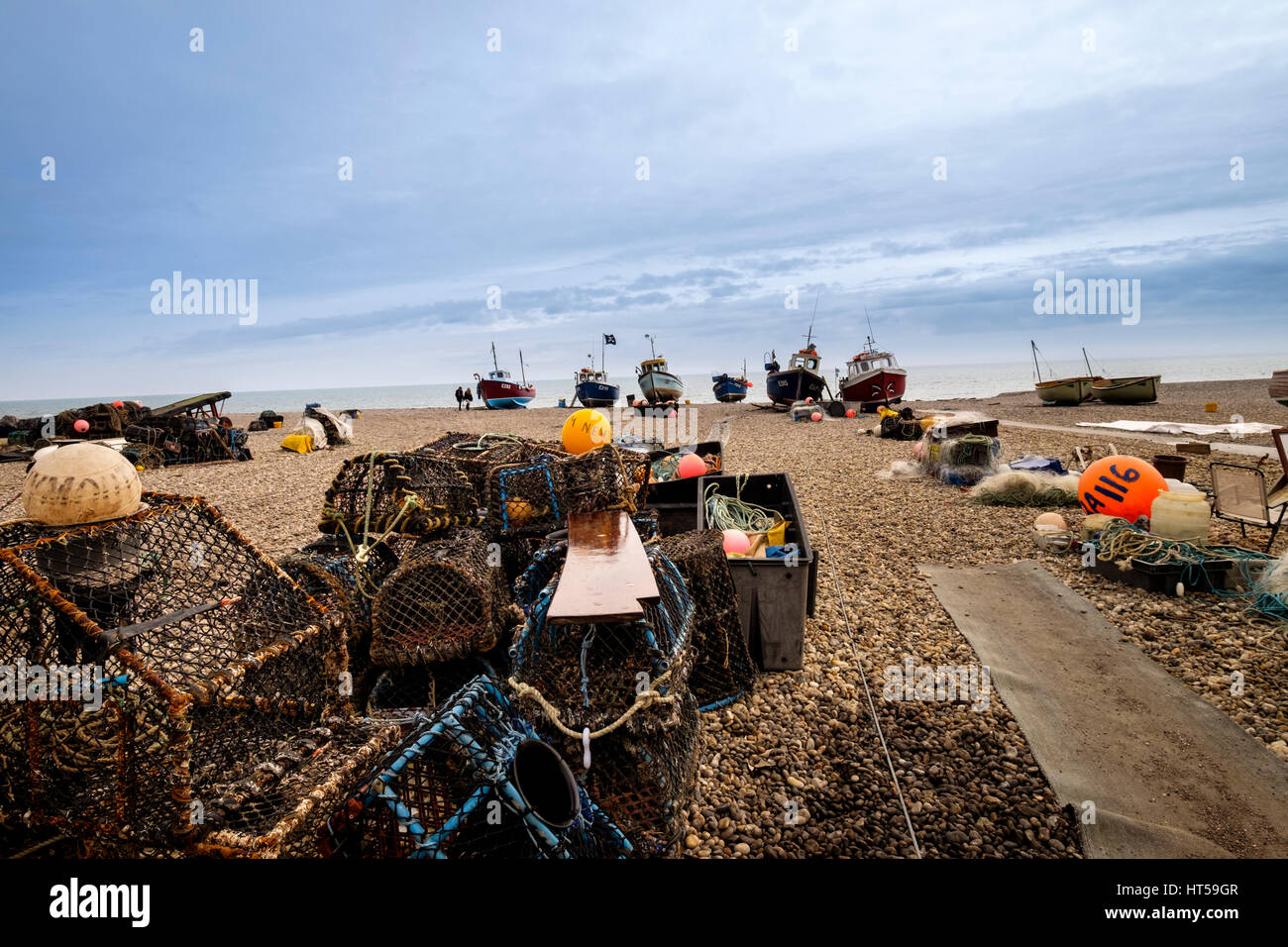 Lobster and crab pots on Beer beach with beach launched fishing boats