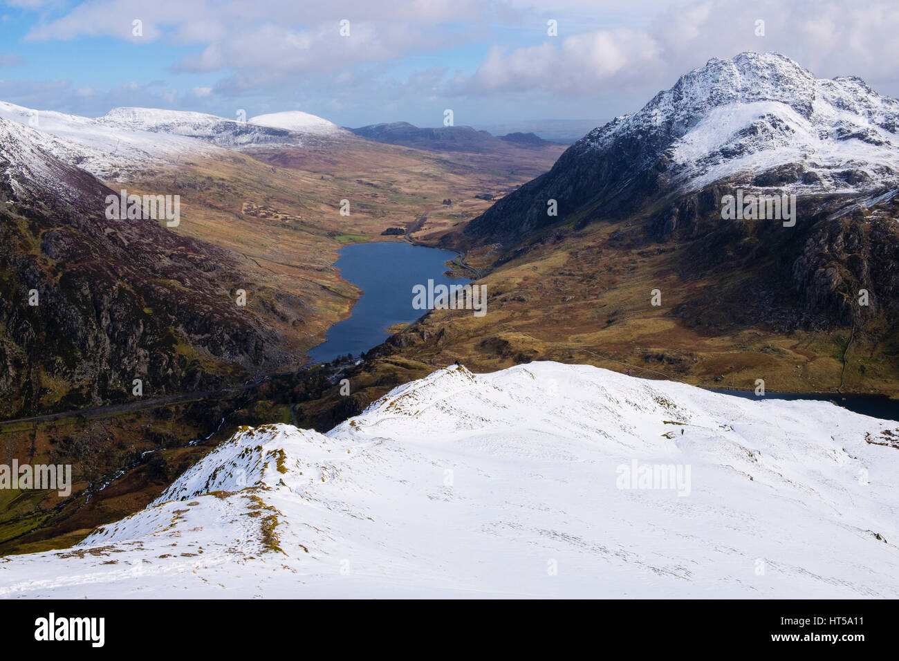 High view to Ogwen Valley and Mount Tryfan from Y Garn ridge with snow