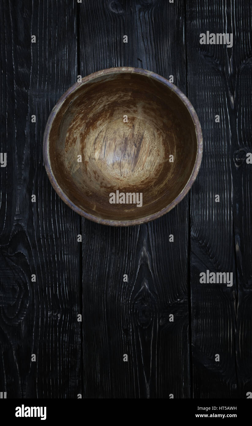 Empty wooden bowl on a vintage table Stock Photo