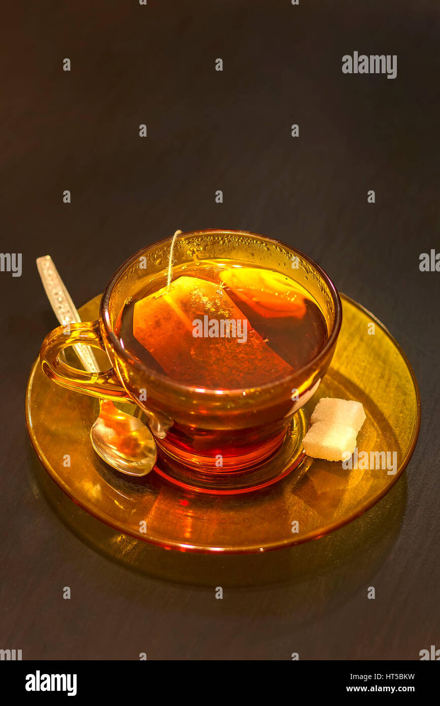 Hot tea cup with tea bag,spoon and sugar on table Stock Photo Alamy