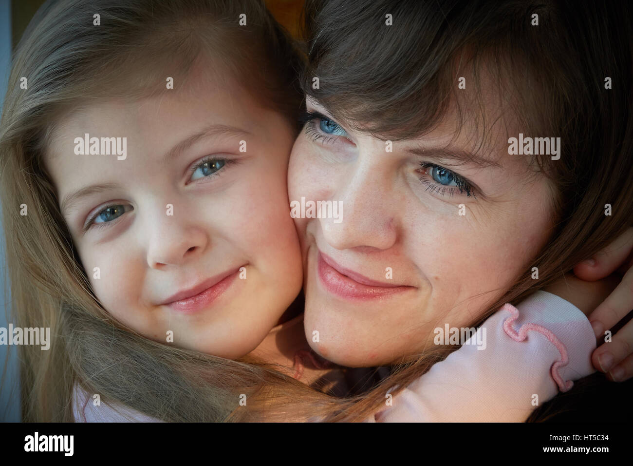 Mom and daughter hug. A symbol of love. Heart Stock Photo