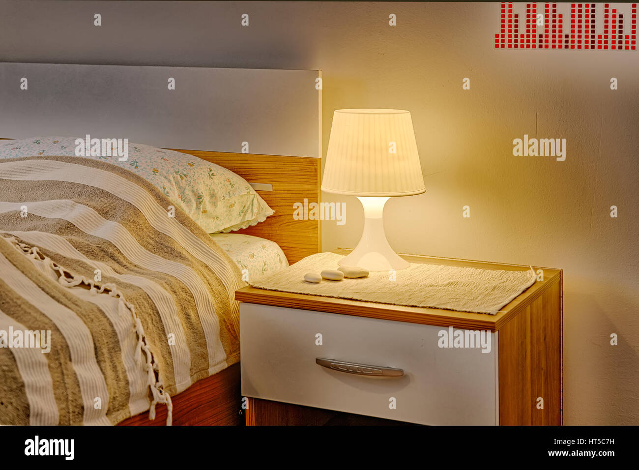 wallstickers, bedside table and lamp Stock Photo