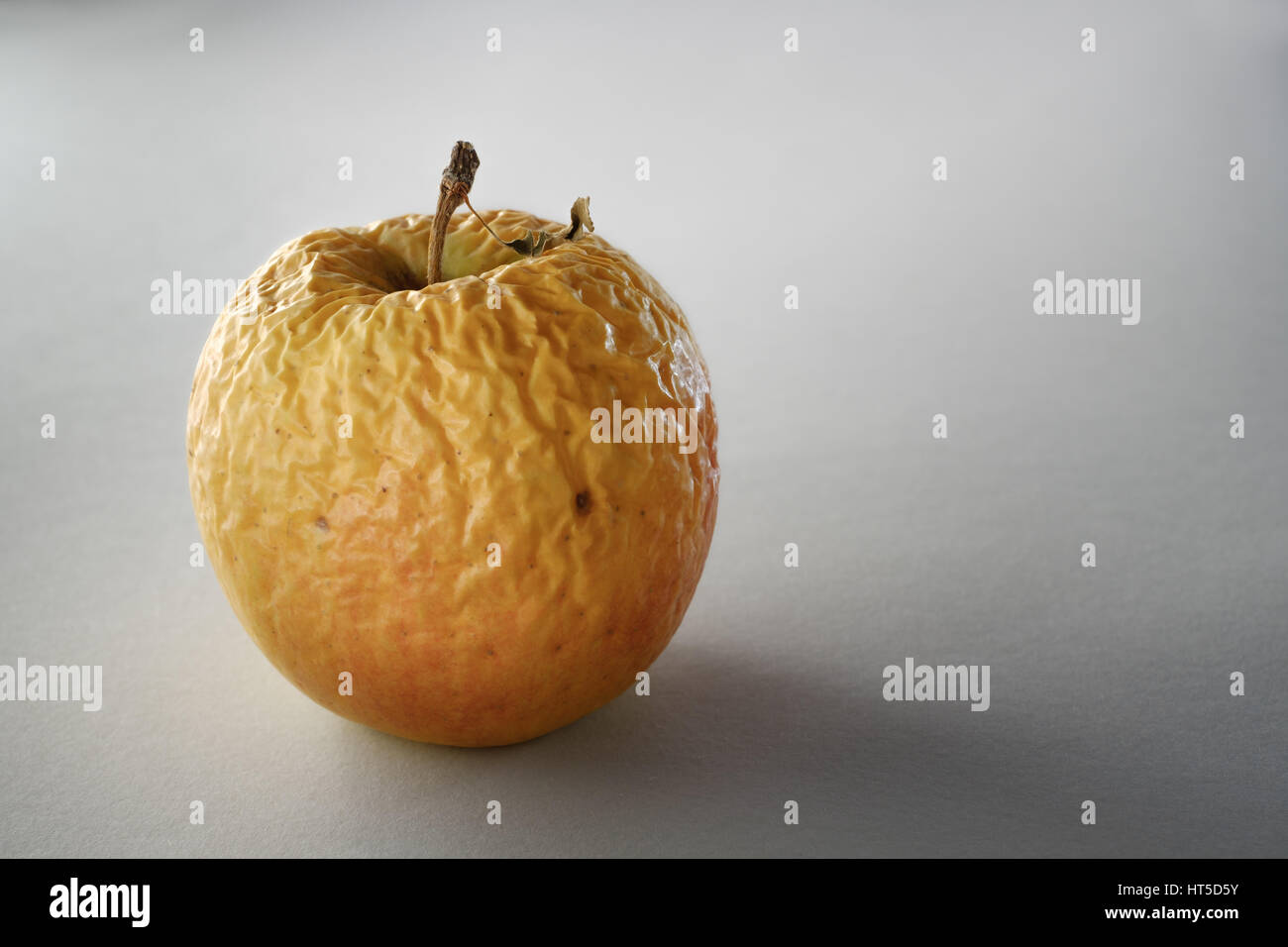 Dry wrinkled apple - Closeup Stock Photo