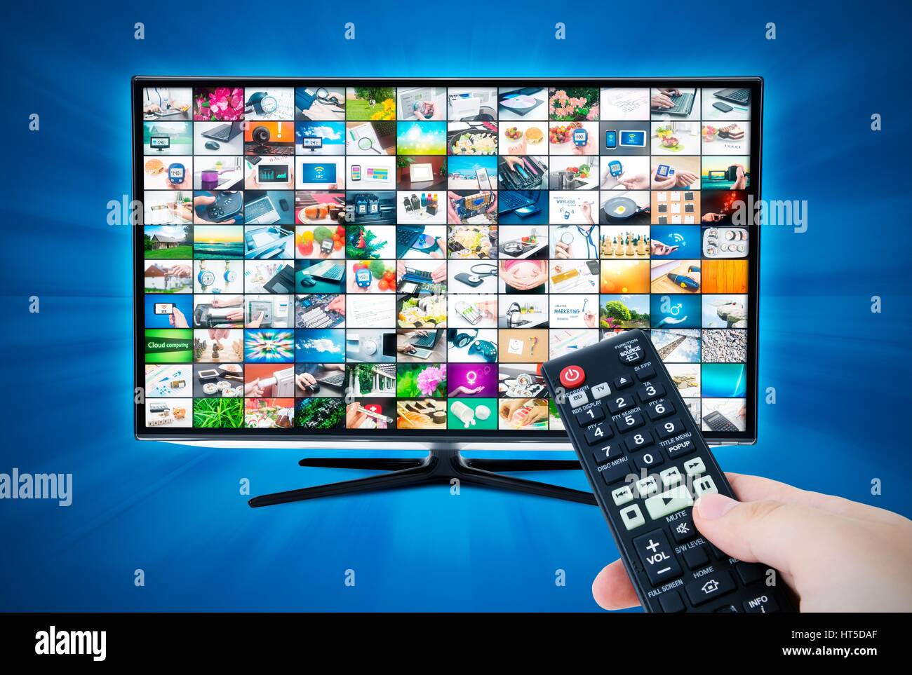 Widescreen high definition TV screen with video gallery. Remote control in hand Stock Photo