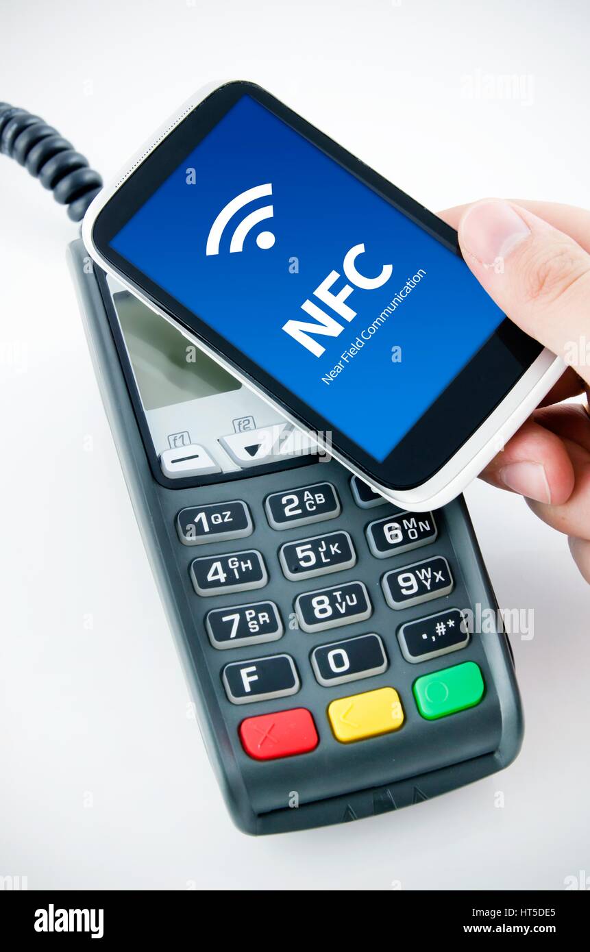 Contactless payment card with NFC chip in smart phone Stock Photo - Alamy