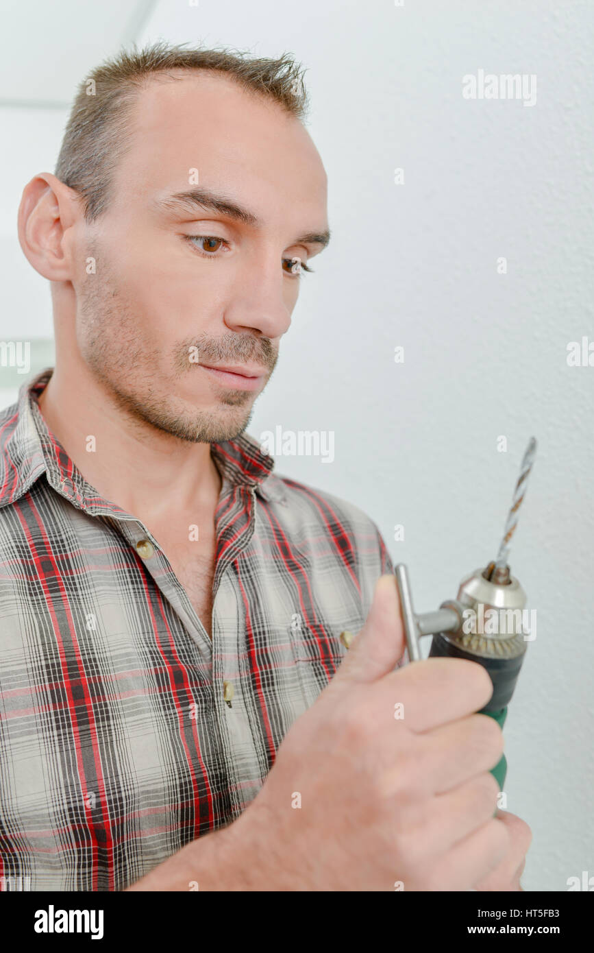 Man using a power drill Stock Photo