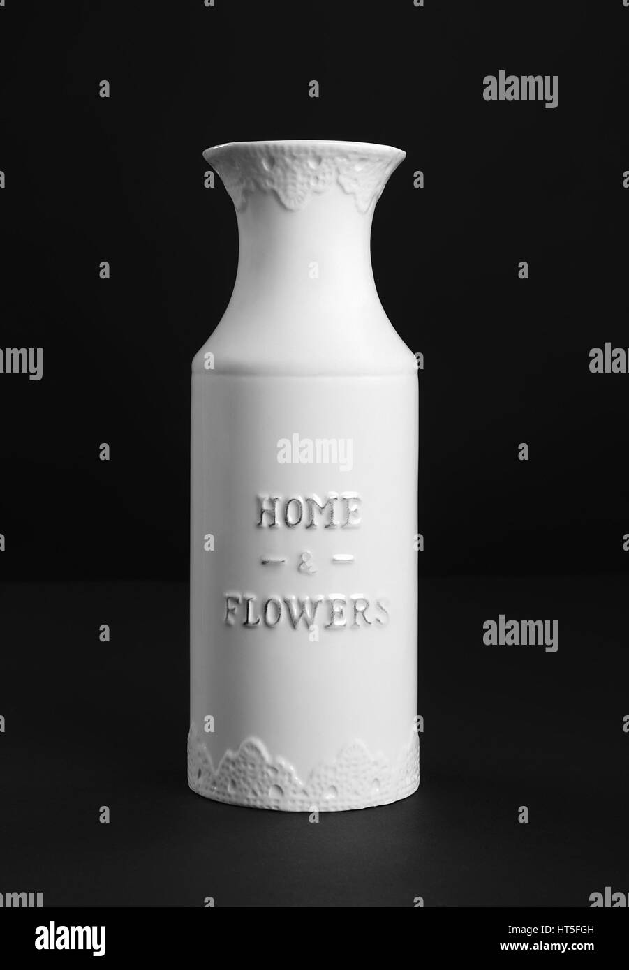 Beautiful white ceramic vase on black background, front view Stock Photo Alamy