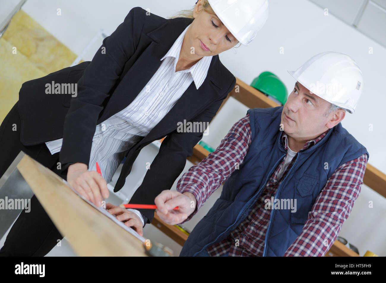 man carpenter and forewoman Stock Photo
