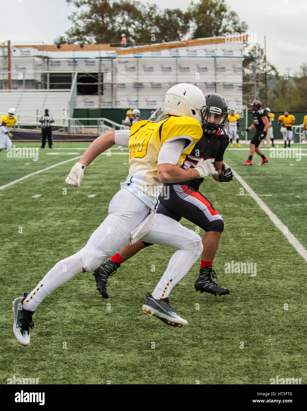 Football cornerback playing man to man coverage on wide receiver Stock