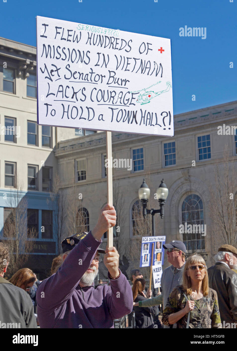 Asheville, North Carolina, USA - February 25, 2017:  Male, American, Vietnam Veteran holds a sign saying 'Seriously? I Flew Hundreds of Missions in Vi Stock Photo