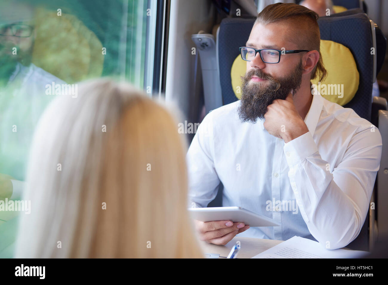 Business couple travel by train Stock Photo