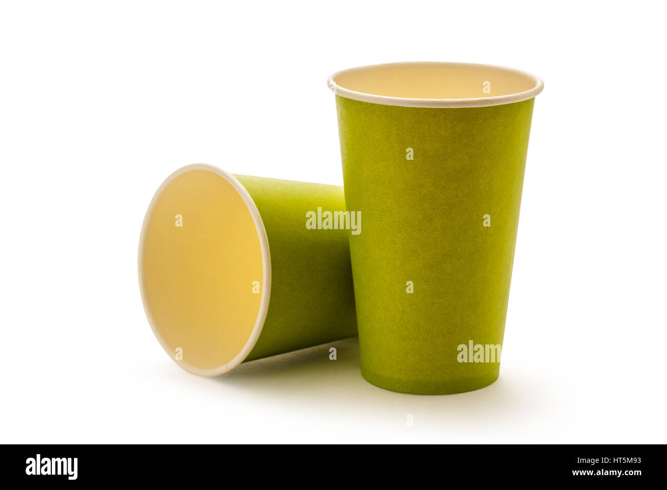 Green paper cups on white background Stock Photo - Alamy