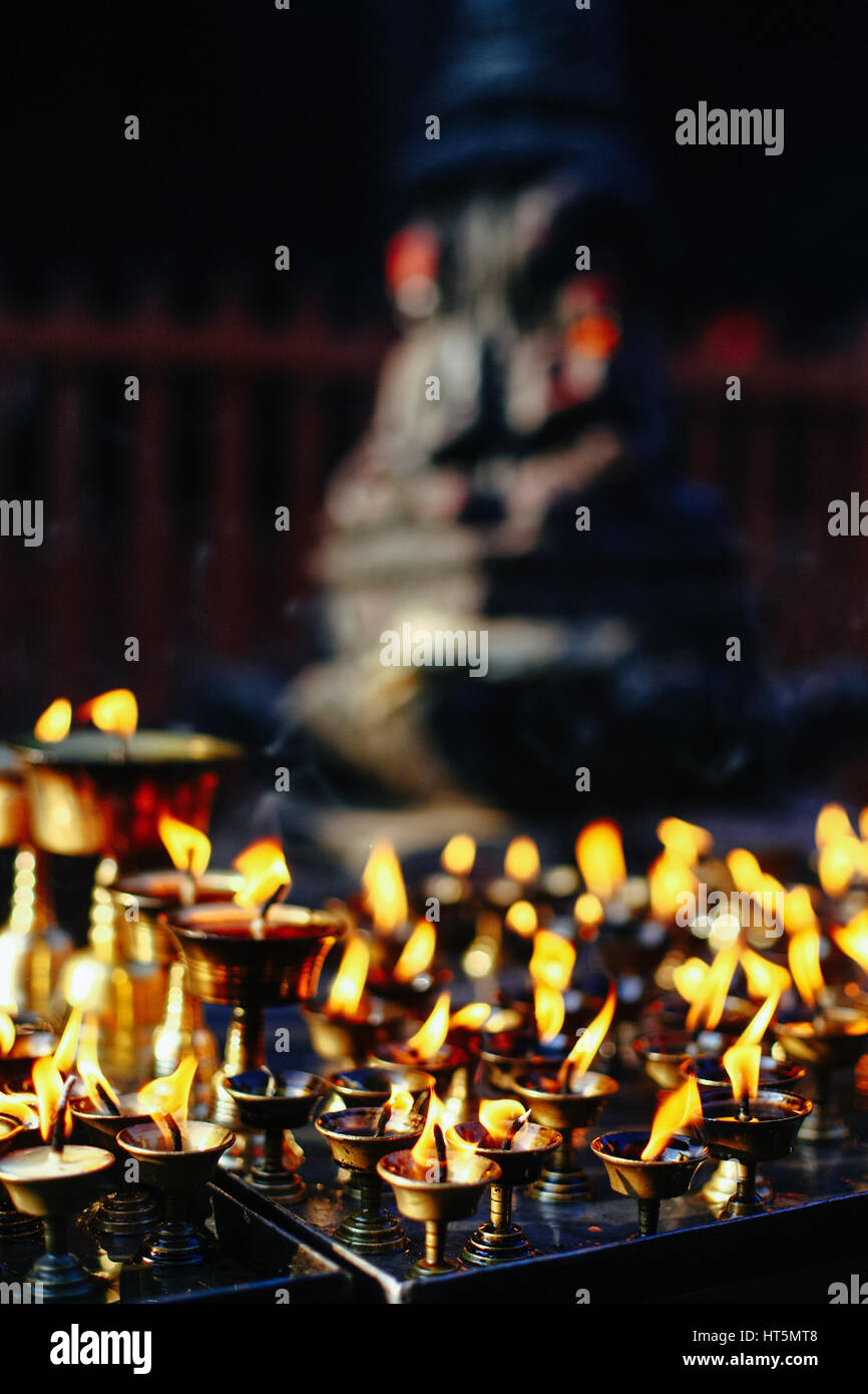 Oil lamps burning in the temple Stock Photo