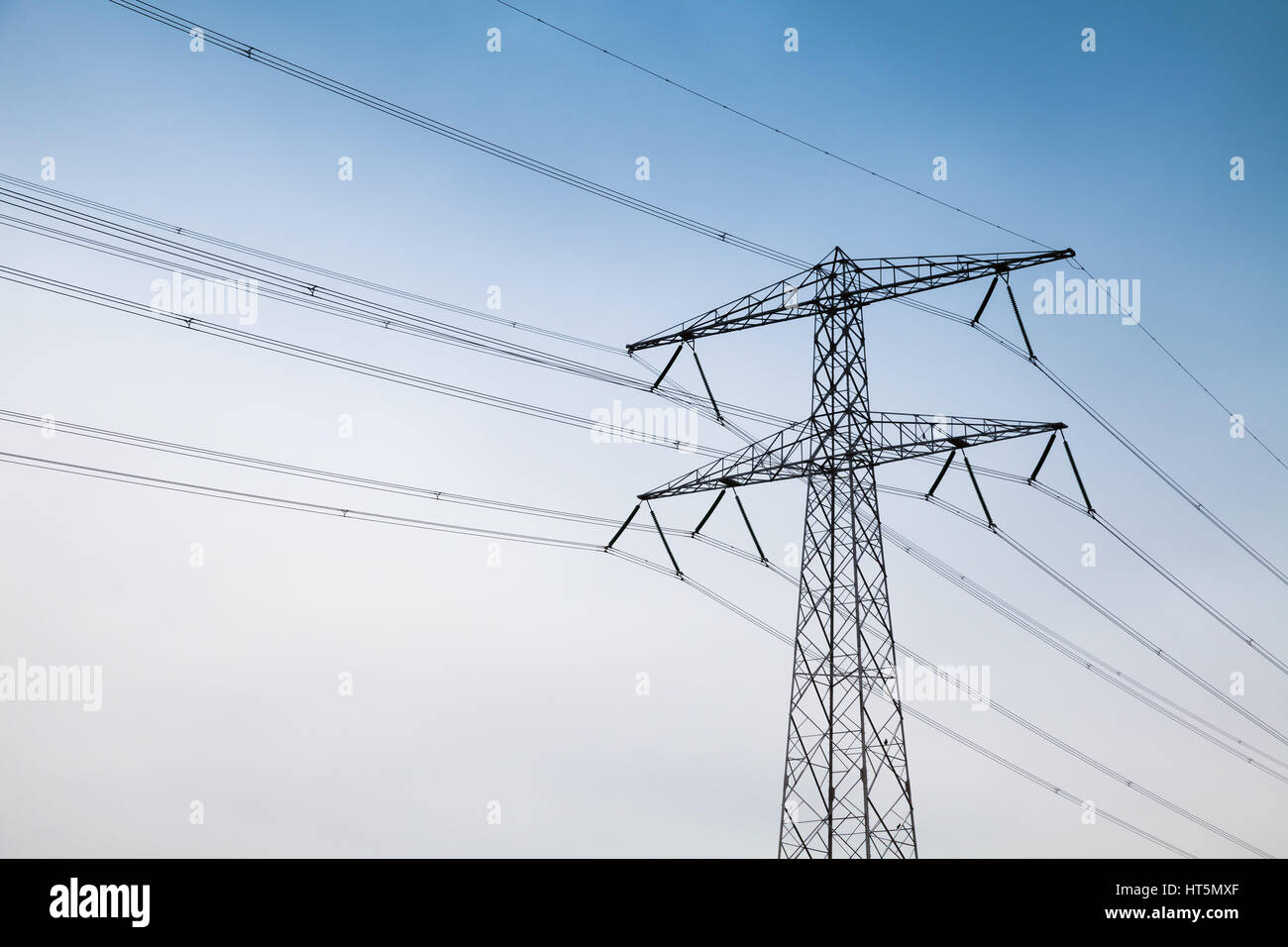 Transmission power tower, electricity pylon. Steel lattice tower, used to support an overhead power line Stock Photo