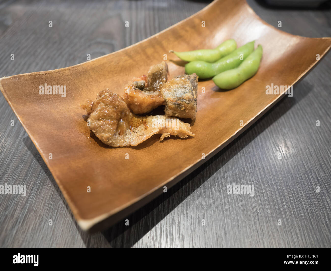 Fish fried and edamame soybean. Appetizers in Japanese restaurant Stock