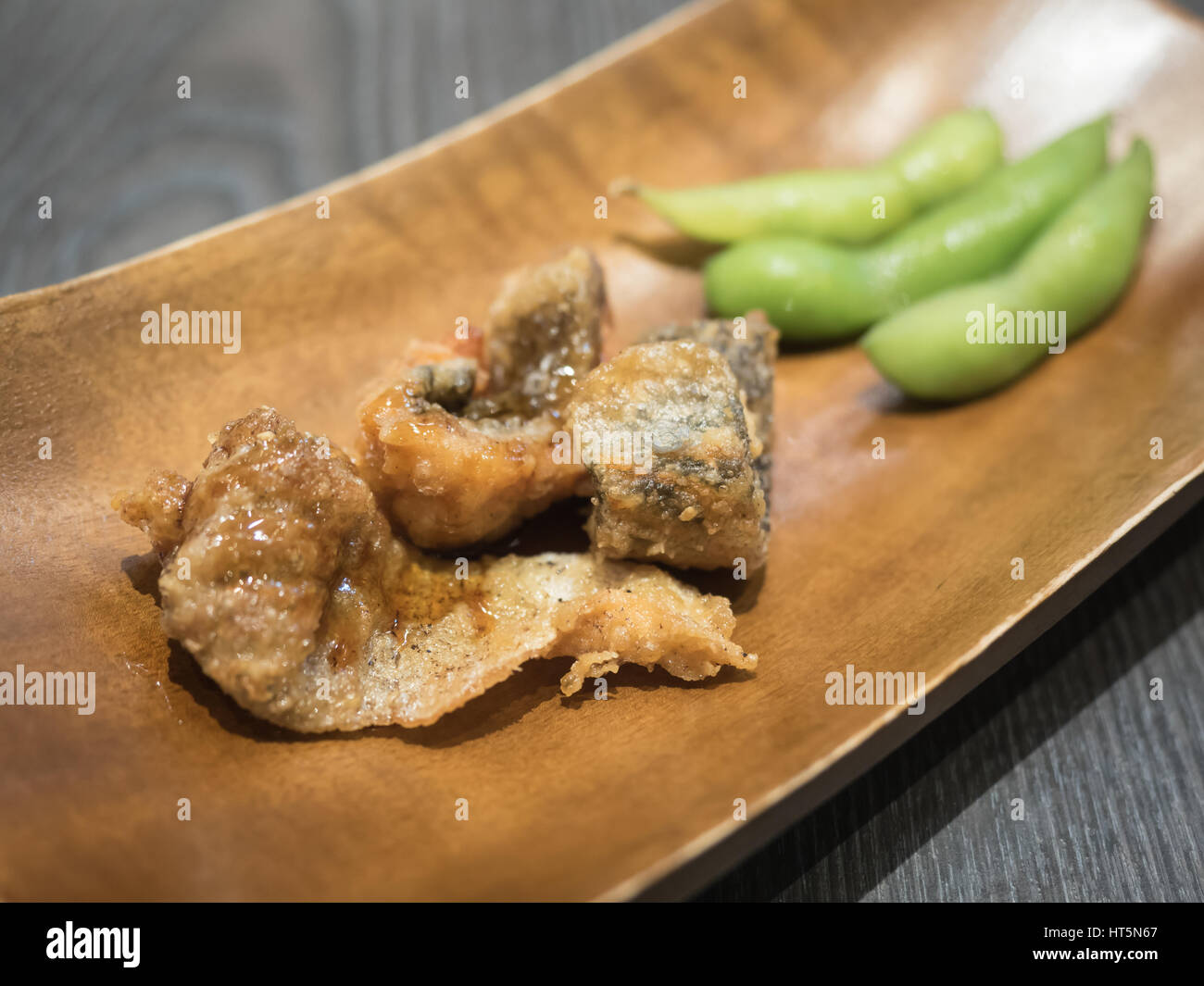 Fish fried and edamame soybean. Appetizers in Japanese restaurant Stock