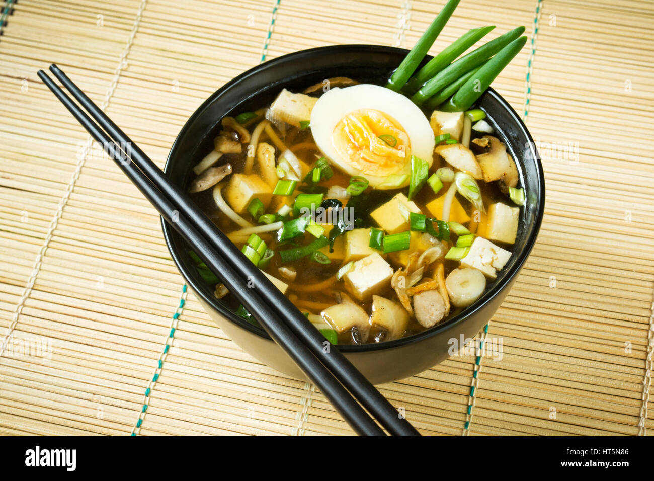 Miso soup in black bowl Stock Photo