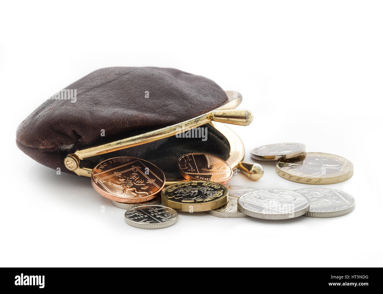 Loose change with an open purse. British coins including the new pound coin introduced in 2017. Stock Photo
