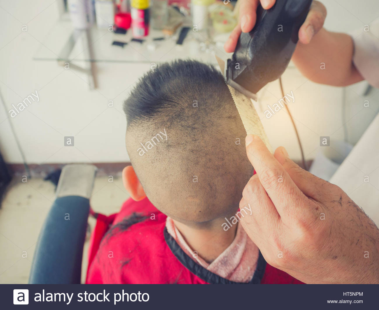 Little Boy Getting Haircut By Barber Stock Photo 135351180 Alamy