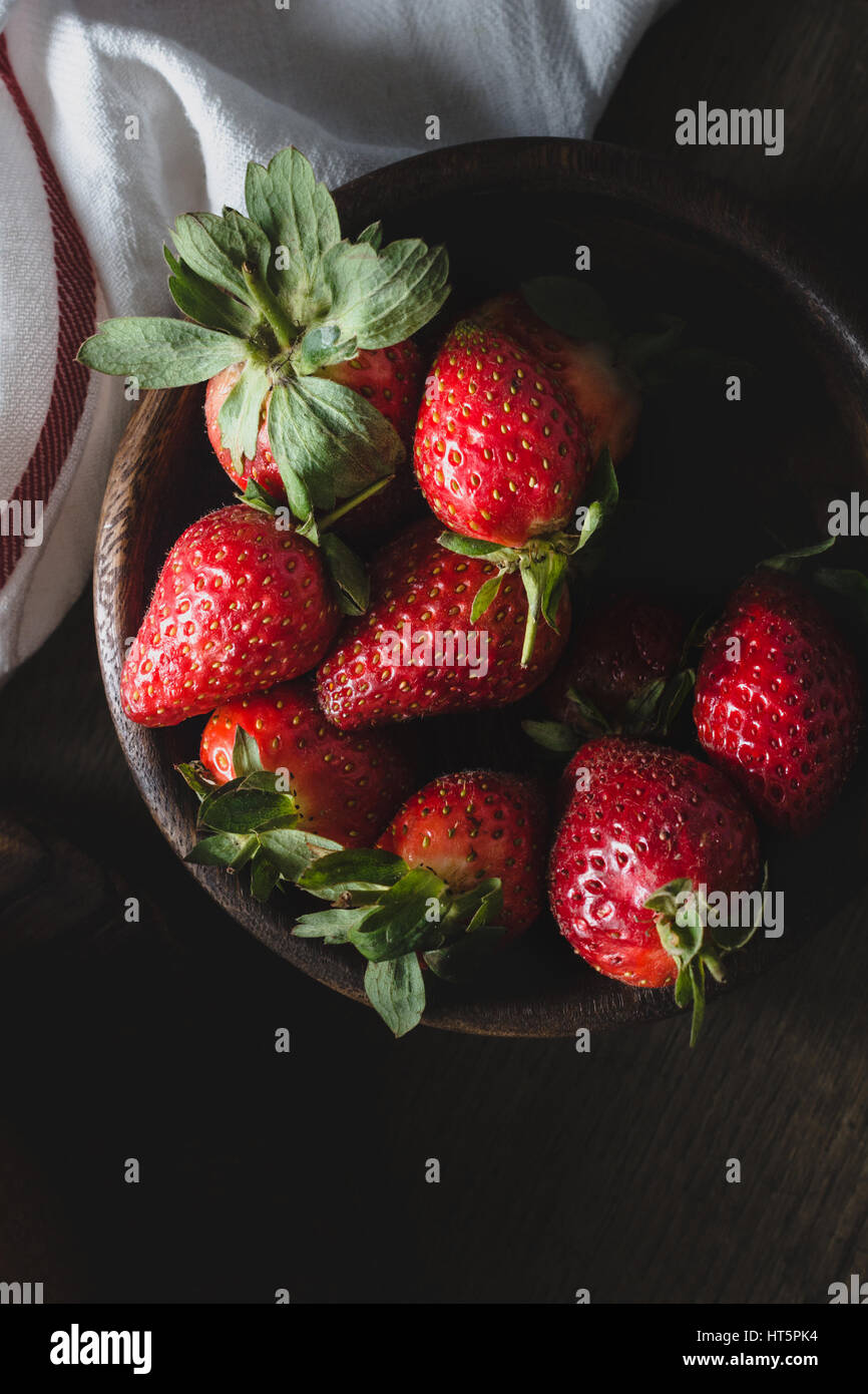 Fresh organic strawberries in a wooden bowl. Top view, closeup Stock ...
