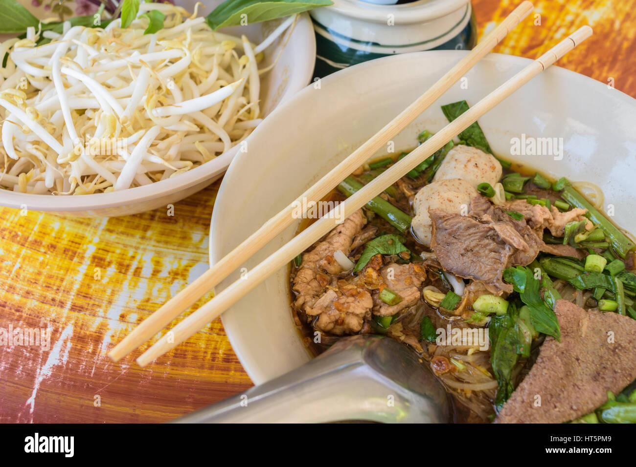 noodle soup with chopsticks in bowl, Thai local food Stock Photo Alamy