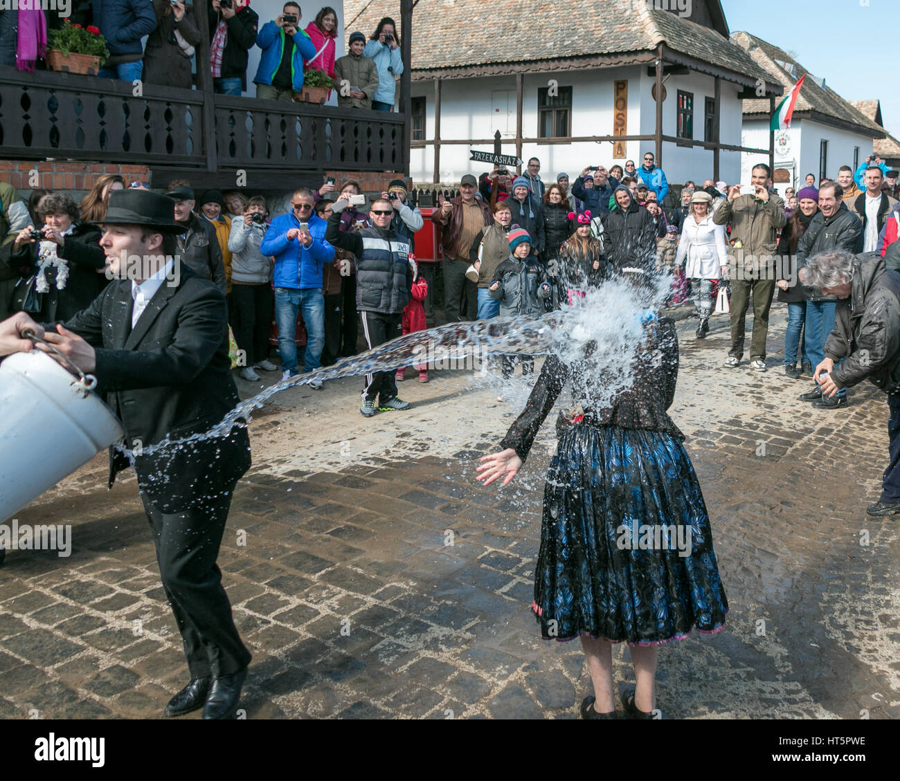 The Hungarian Easter Monday tradition of throwing water at girls Stock Photo