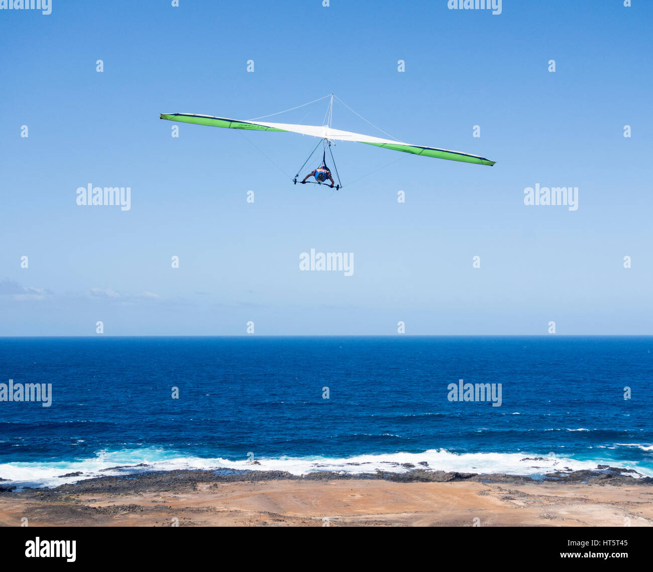 Hang Glider taking off over the Atlantic Ocean in Las Palmas on Gran Canaria, Canary Islands, Spain Stock Photo