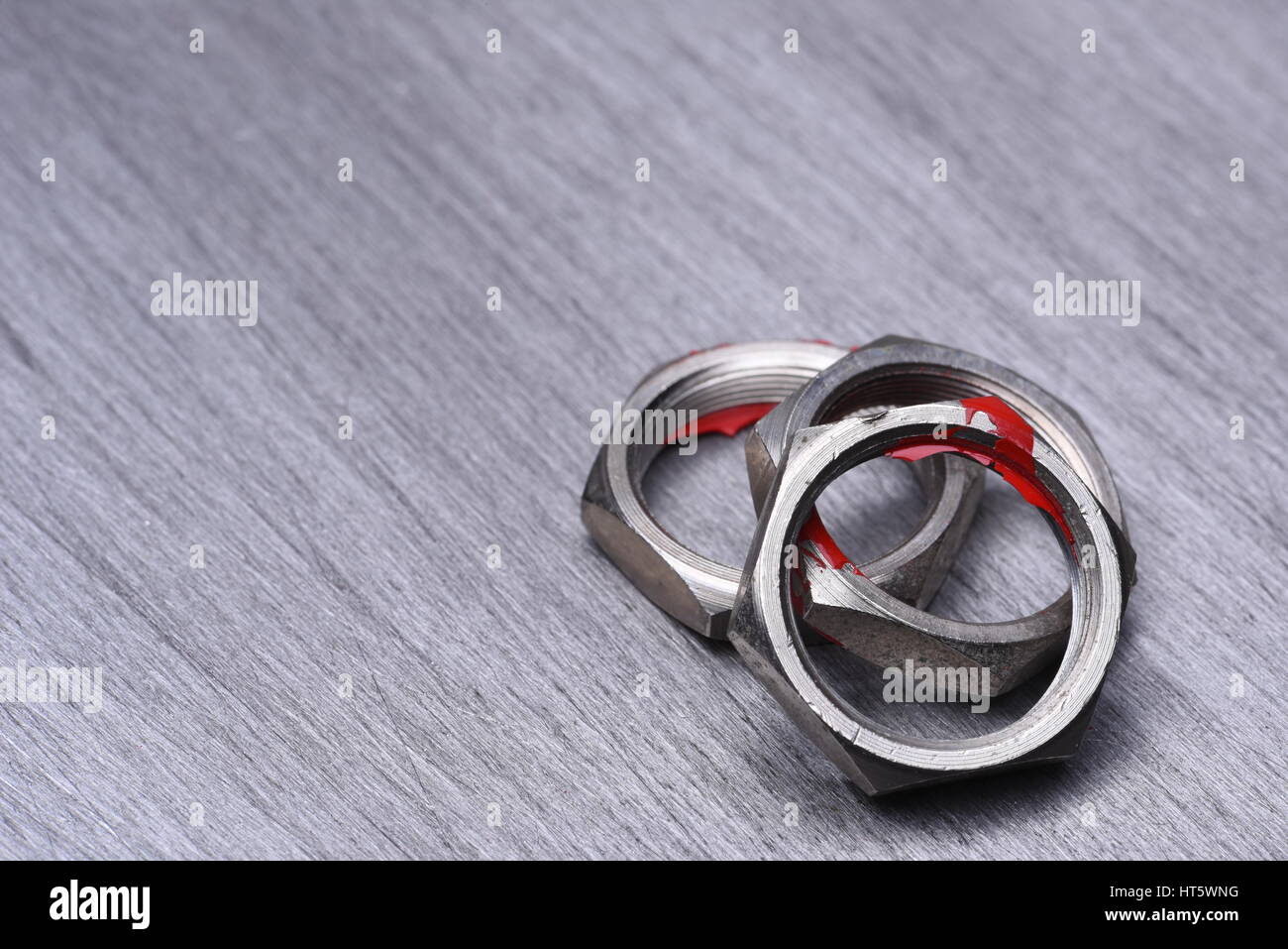 Steel Nuts on Metal Background, Copy Space Stock Photo