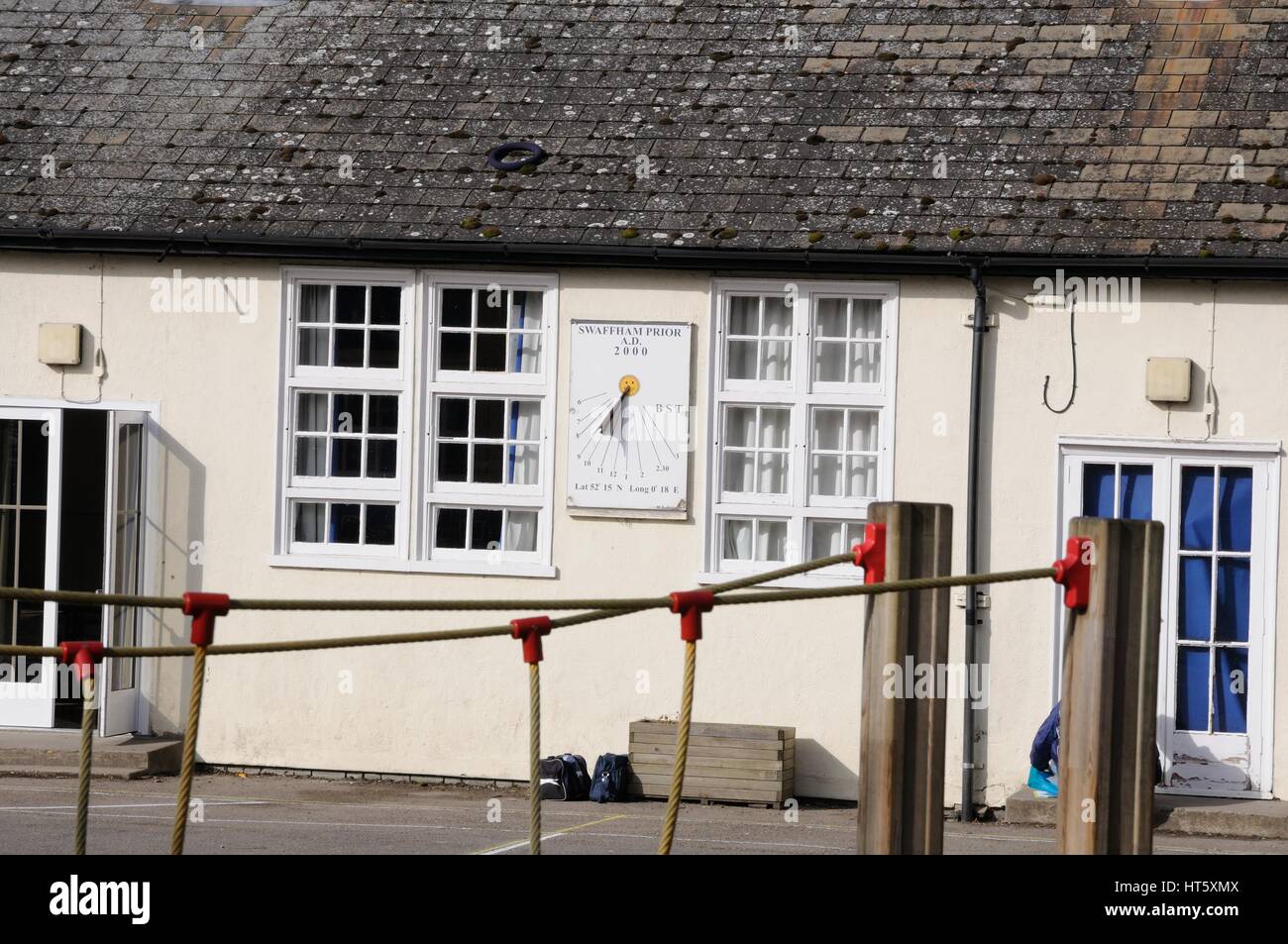 Sun dial on the school, Swaffham Prior, Cambridgeshire Stock Photo