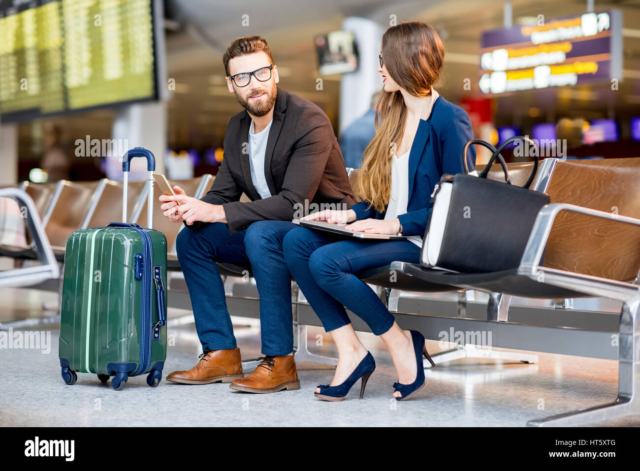 Business couple at the airport Stock Photo