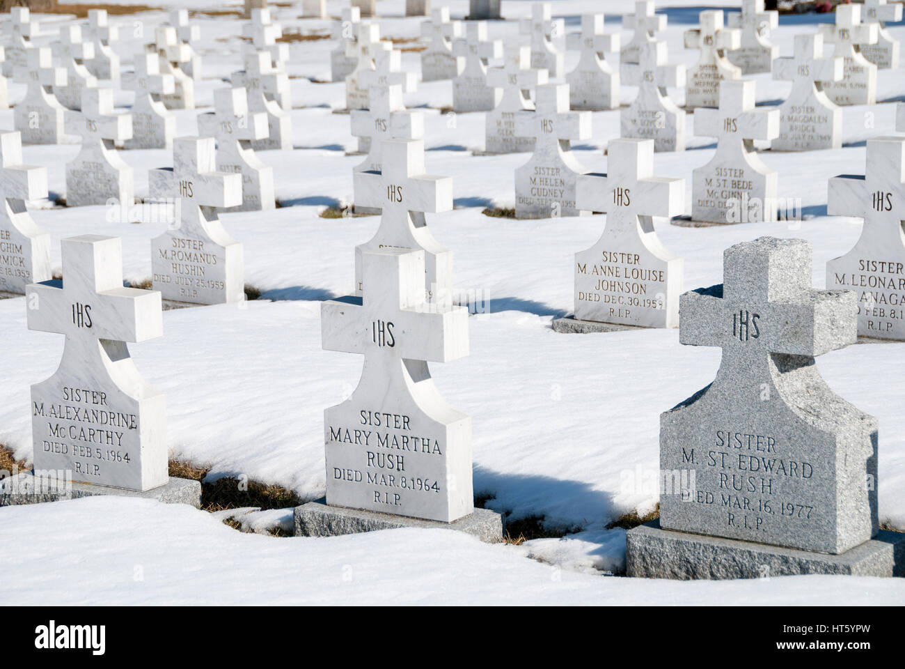 Symmetrical rows of headstones in a cemetery marking the graves of Catholic nuns Stock Photo