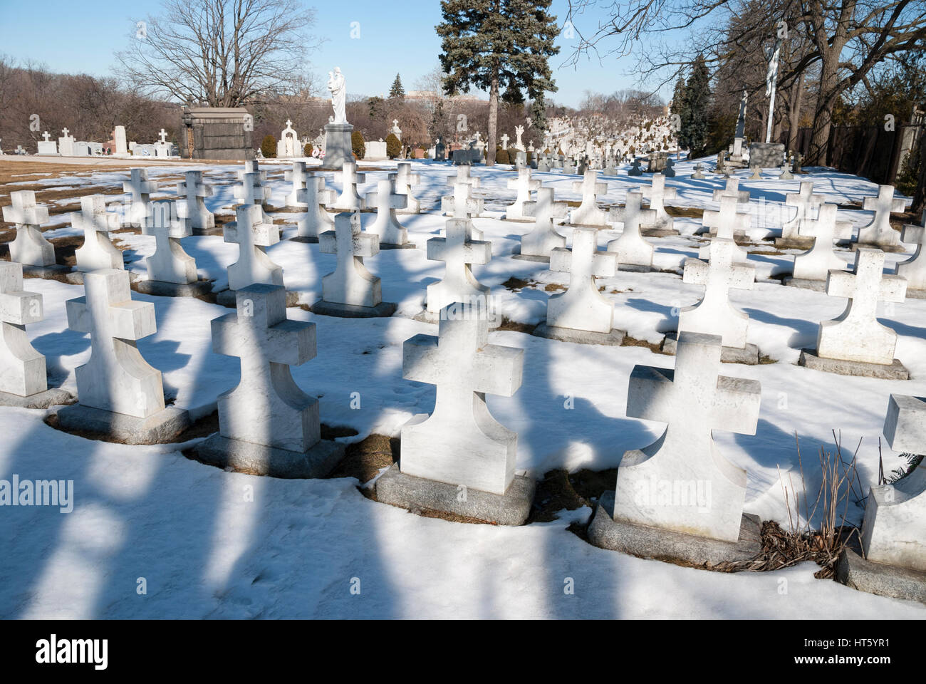 Symmetrical rows of headstones in a cemetery marking the graves of Catholic nuns Stock Photo