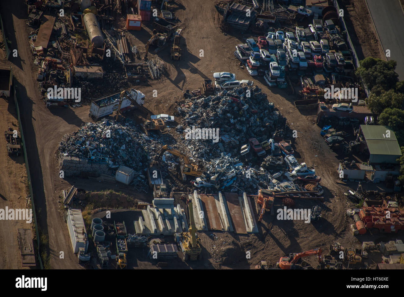 An aerial view of a car wrecking yard, with cubes of crushed vehicles. Stock Photo