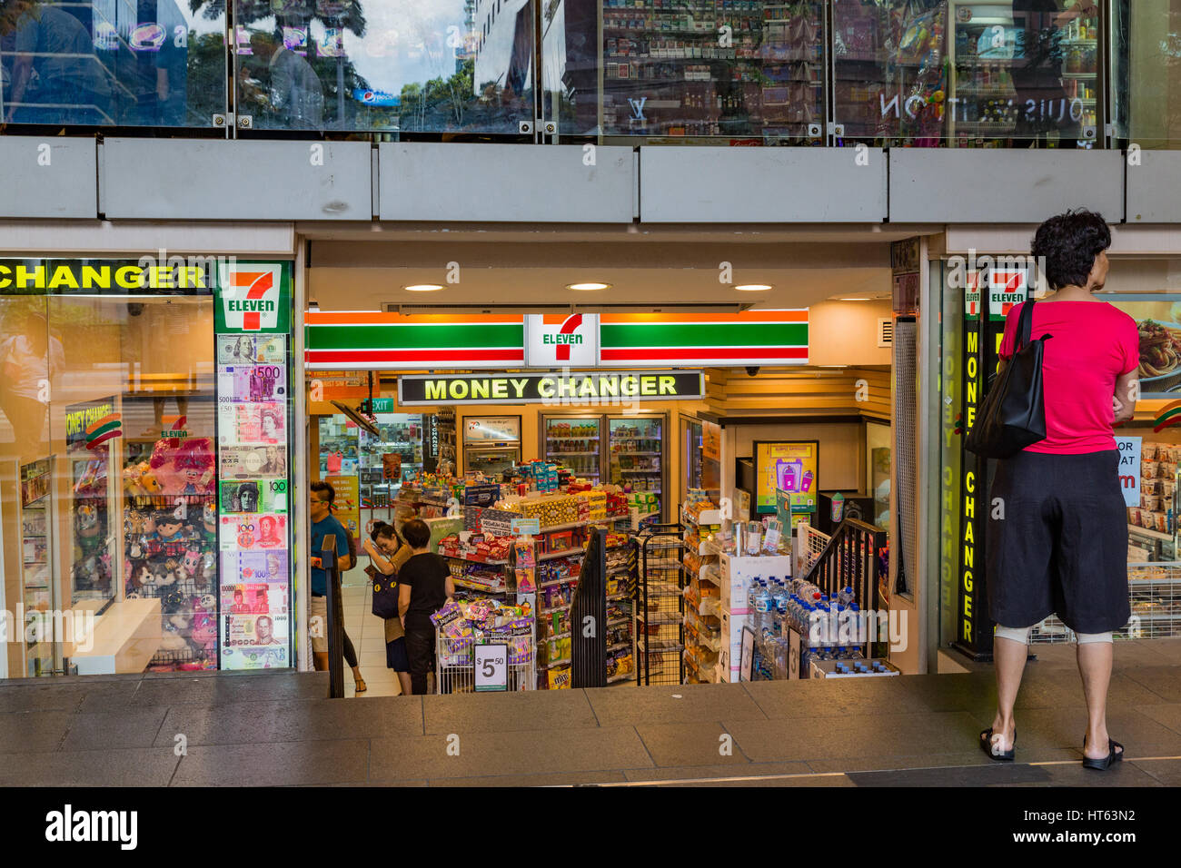 A 7 Eleven shop and money changer in Orchard Road, Singapore Stock ...